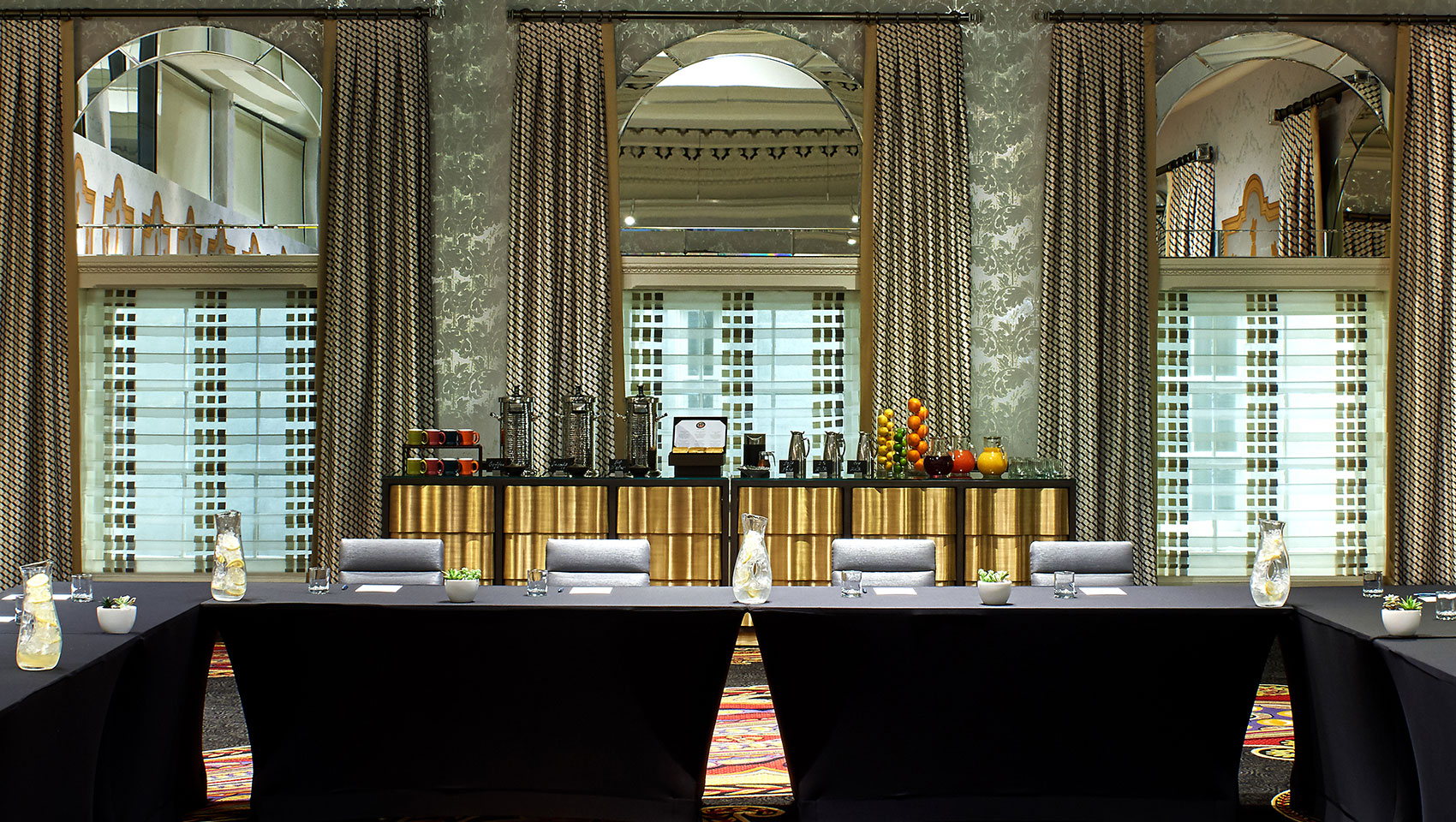 Closeup of coffee station and u-shape meeting room set up in Athens room at Kimpton Hotel Monaco Washington DC