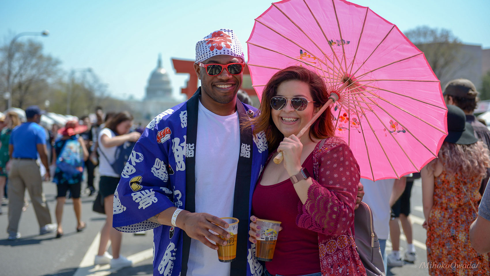 man and woman smiling and wearing sunglasses