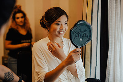 Bride looking in mirror